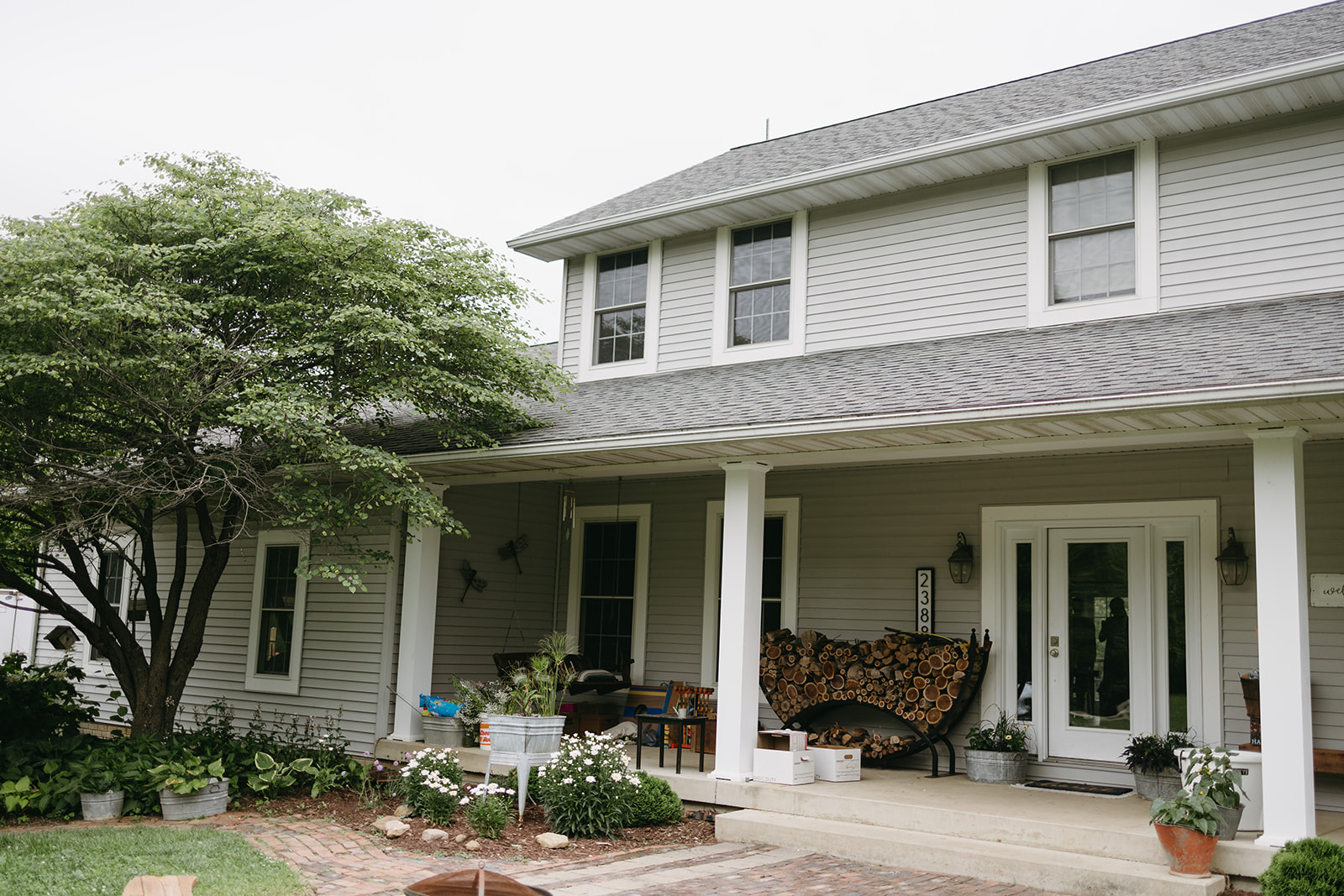 A cozy backyard wedding setting at the bride’s family home with natural landscaping.